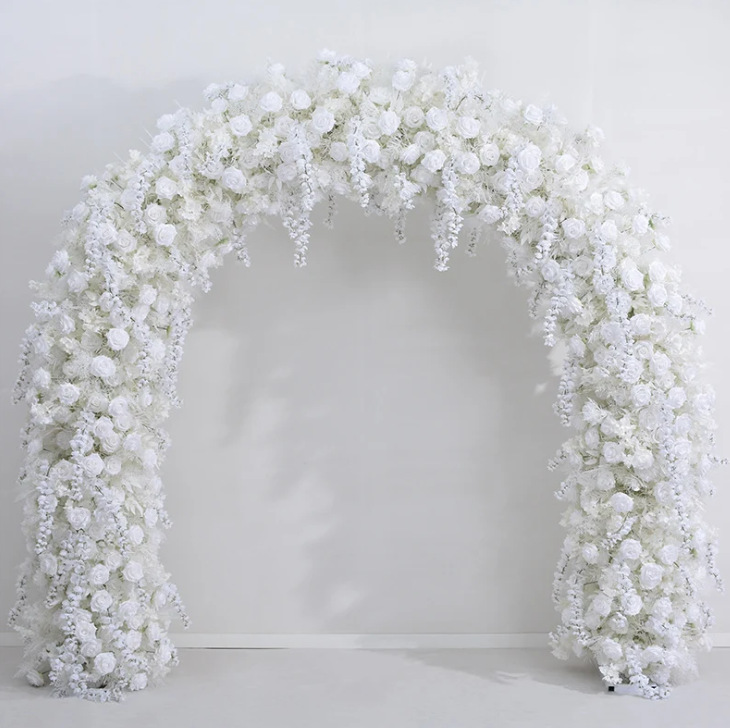 White faux floral arch photographed in the supplier studio